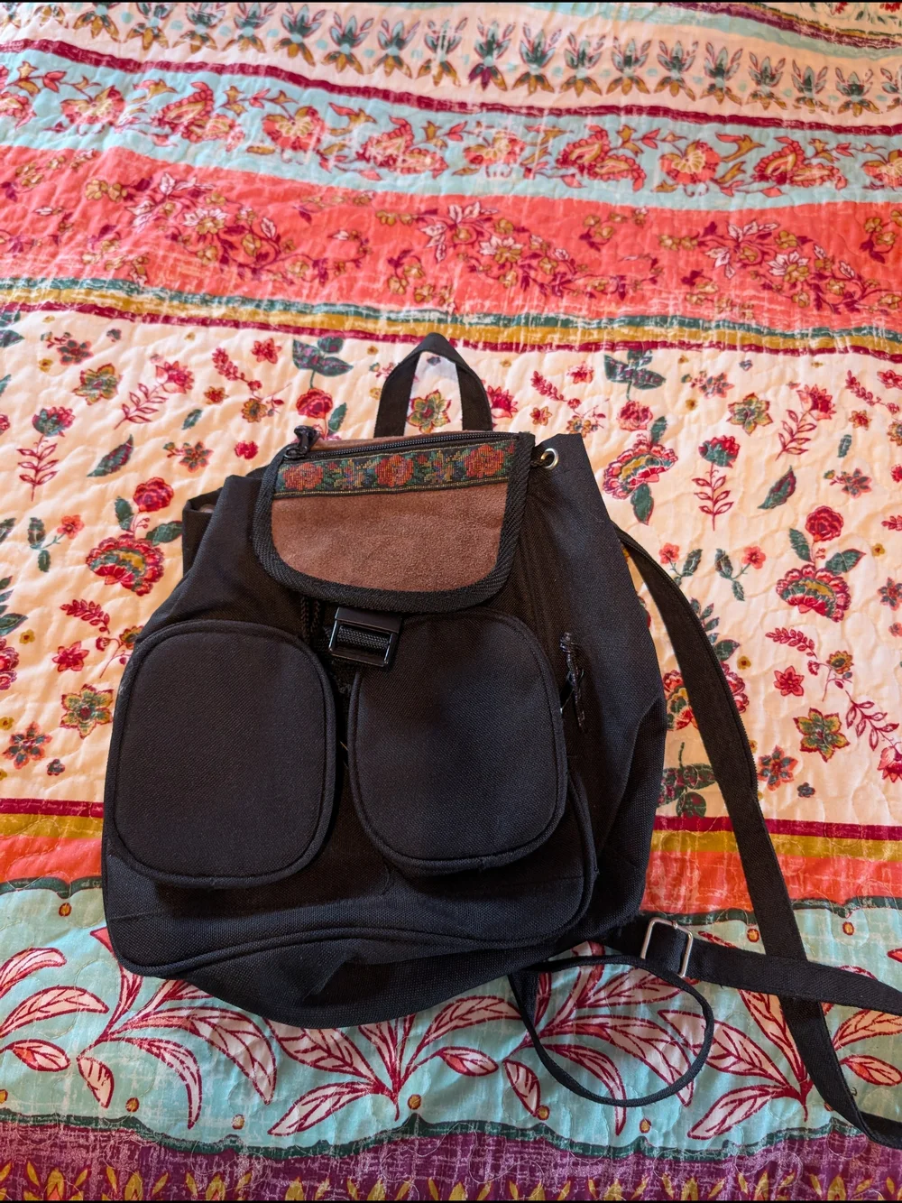 Black Canvas Backpack with Embroidered Flap and Suede Accent
